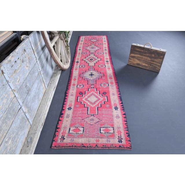 Vintage Turkish Hand-Knotted vintage rug is a semi-Vintage runner rug.'70s Eastern region of Turkey's unique rug is...