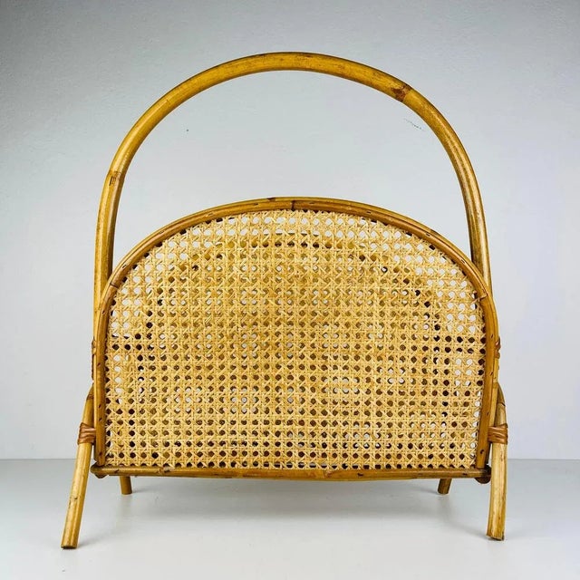 Step into the world of refined mid-century style with this stunning bamboo and rattan magazine stand. Its unique shape and...