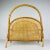 Step into the world of refined mid-century style with this stunning bamboo and rattan magazine stand. Its unique shape and...
