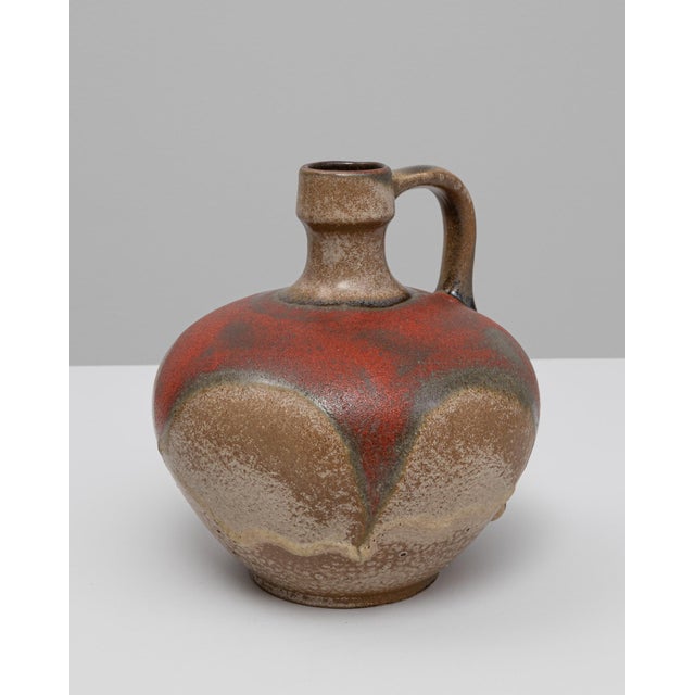 20th Century German ceramic vase. This striking mid-century vase exemplifies the bold glazing techniques of West German...