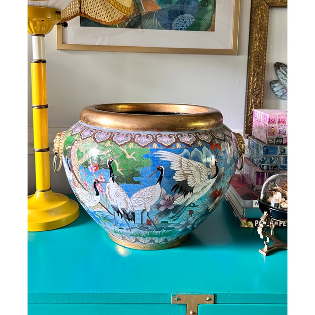 This monumental cloisonné enamel jardiniere is less a decorative accessory than a work of art. Every inch of its surface...