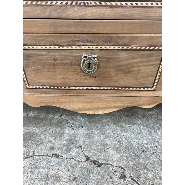 Elegant French 19th-century Louis XVI commode crafted from beautifully bleached walnut, featuring three drawers with...