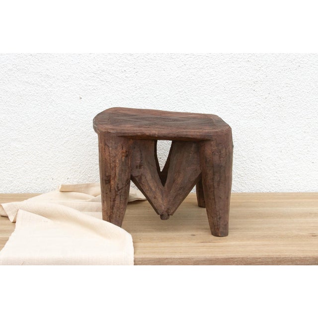 A unique piece of African art, this vintage Nupe table from Nigeria is a must-have for collectors and enthusiasts of Nupe...