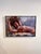 This oil painting depicts a reclining figure, captured in a moment of serene contemplation. The artist employs bold...