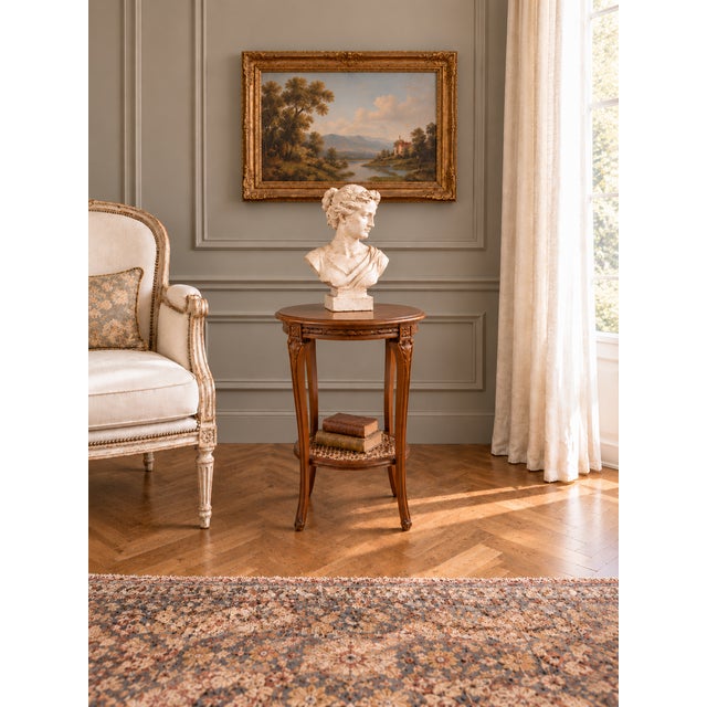A refined French guéridon dating from the early 20th century, circa 1900–1930. This elegant small side table appears to be...