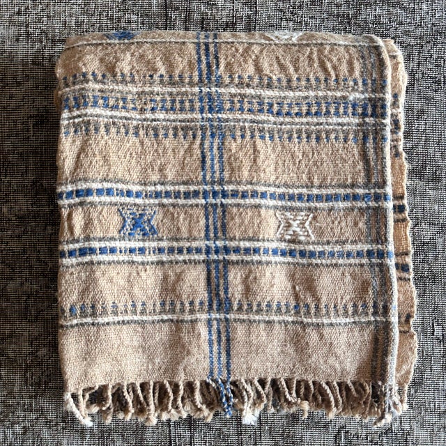 Beautiful hand-loomed throw woven with naturally dyed wool. Featuring a subtle geometric pattern with classic stripes to...