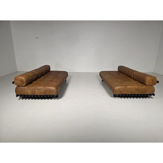De Sede DS-80 cognac leather patchwork daybeds, Switzerland, 1970. Upholstered in its beautiful and soft original aniline...