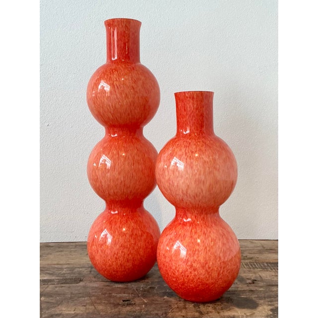 This exquisite pair of hand-blown Murano glass vases captures the vibrant spirit of Italian Mid-Century artistry. Crafted...