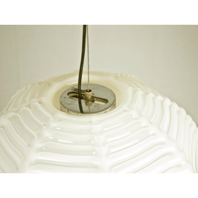 Spherical diffuser in ivory Murano hand made glass with decorative treatment in strong relief as to emulate a Japanese...