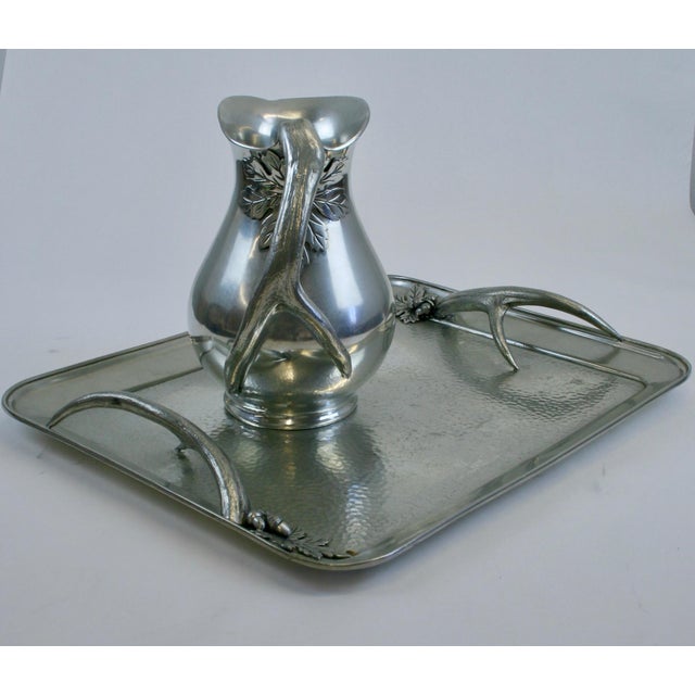 A rugged and substantial Italian Pewter Pitcher and Tray stamped and labeled on both pieces as having been made in Italy...