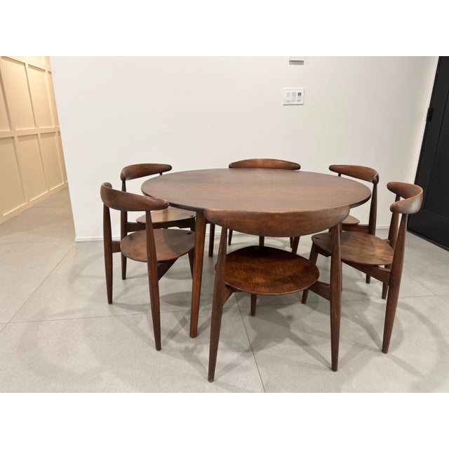 Dining Set designed by Hans J. Wegner circa 1952 Manufactured by Fritz Hansen Denmark Set of six three legged Heart dining...