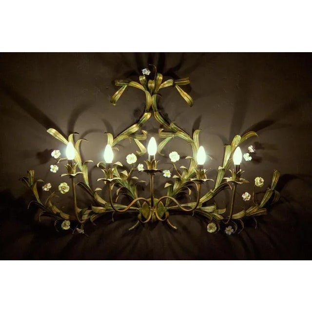 Fine Italian five arms Wall light or scone ornamented with colorful porcelain flowers and hand painted tole leaves. Five...