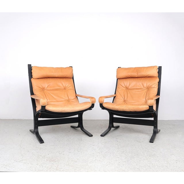 Wooden plywood chairs with leather cushions made by Westnofa Norway. Designed by Ingmar Relling in the 1960s. The wooden...