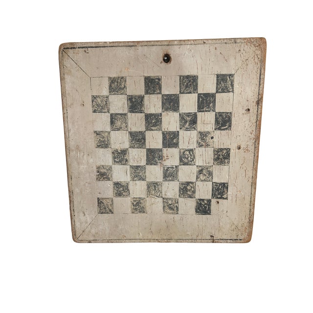 Early double sided b&w painted game board. One side for nine men's morris, reverse side is a checker board. Edge has...