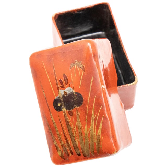 Offering this stunning red lacquered paper mâché pillbox. The bottom and inside of the box are black lacquer. The front is...