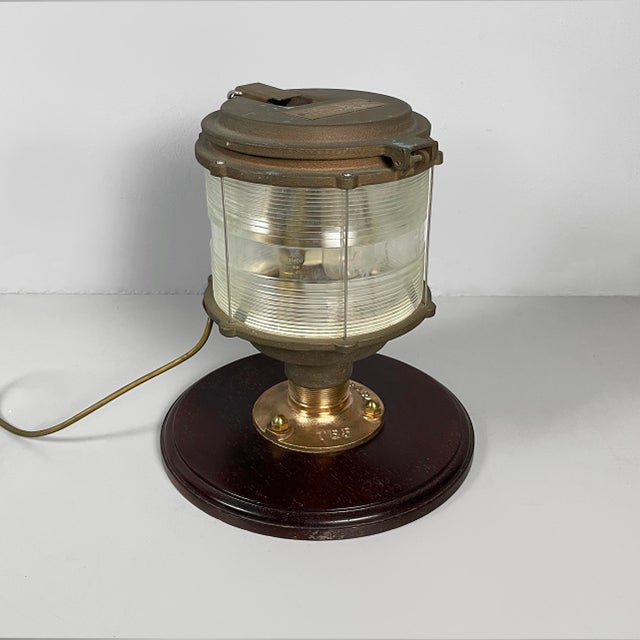 Italian mid-century modern ship's lamp in wood, glass and metal, 1950s Ship's table lamp with a cylindrical glass diffuser...