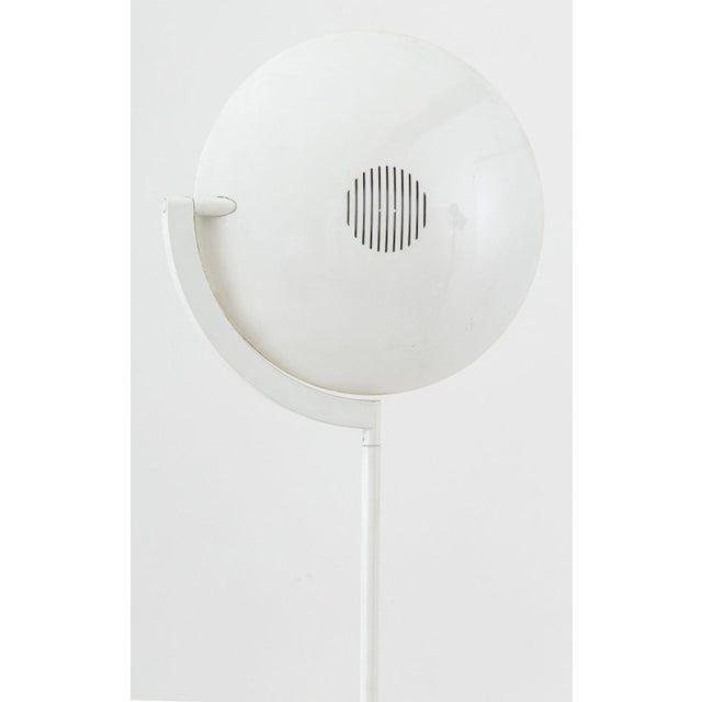 Postmodern White Enameled Metal Floor Lamp, with adjustable uplight shade above a circular dome base. 69" H x 14"...