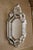A refined expression of Venetian artistry, this handcrafted mirror features exquisite hand-engraved motifs on antiqued...