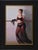 The artwork captures a poised figure draped in sheer, flowing fabric, exuding a sense of elegance and confidence. Soft,...