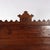 An Eastlake style full-size bed from circa 1900, featuring intricate chip carving on walnut wood. The bed showcases the...