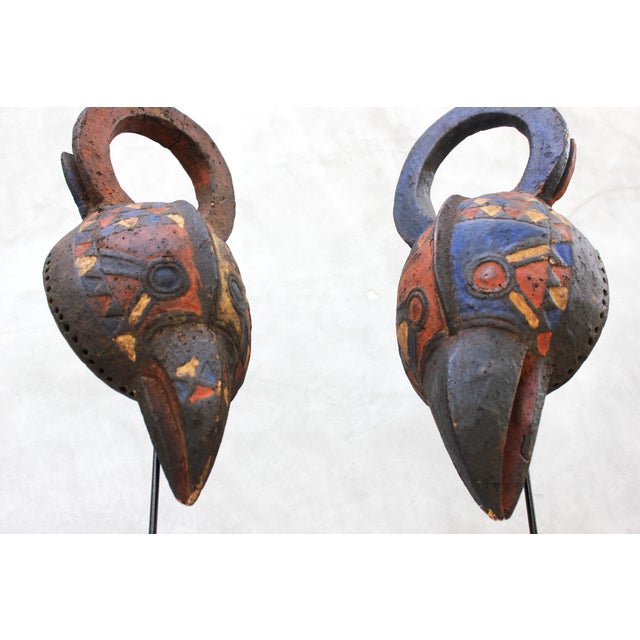 This sculptural pair of African bird masks embodies the strong graphic language and symbolic abstraction characteristic of...