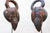 This sculptural pair of African bird masks embodies the strong graphic language and symbolic abstraction characteristic of...