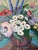 Beautiful 1960’s vintage still life oil on canvas featuring a vibrant floral arrangement in a rustic vase, accompanied by...