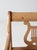 This antique lyre back armchair features scroll arms, splayed legs, and a carved lyre motif. The aged painted finish shows...