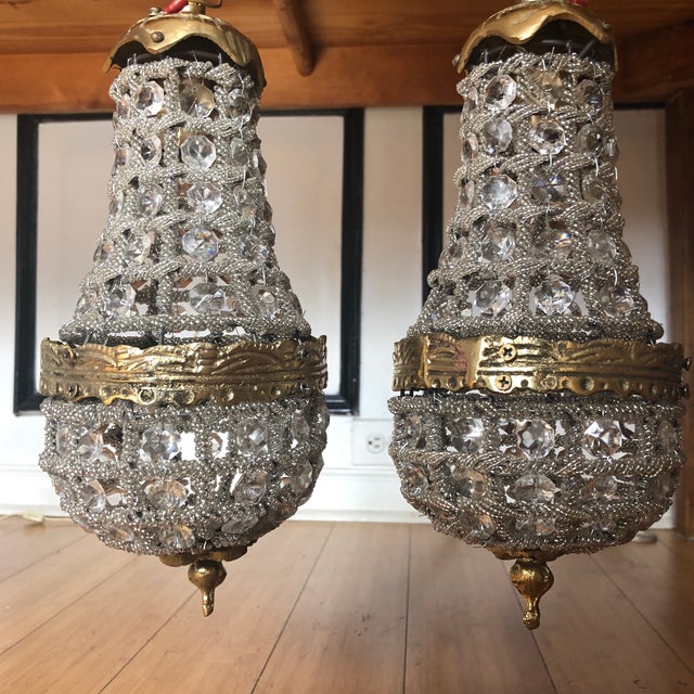 Gorgeous Brass and Crystal pair of miniature Chandeliers. Great for a countertop space or a vanity space. Perfect for the...