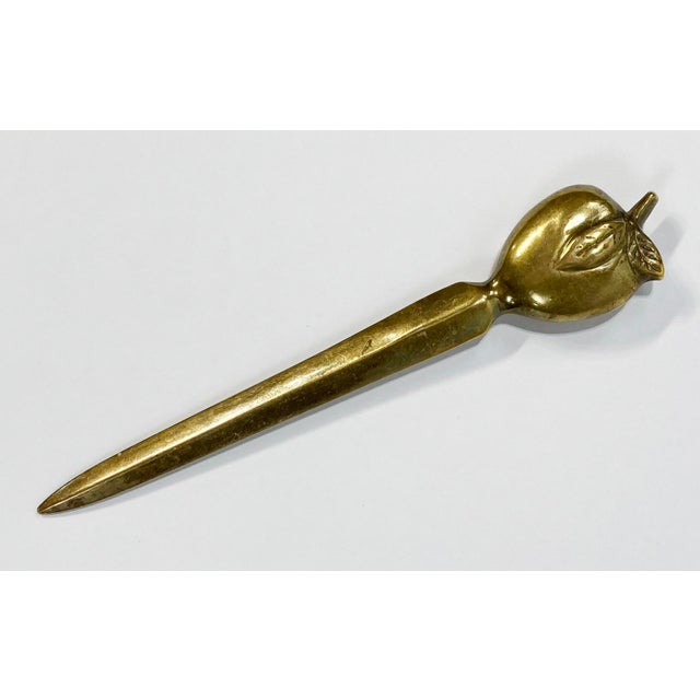 Vintage solid brass apple motif letter opener. Lovely patina with minor signs of age and use.
