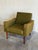 This lounge chair features a structured frame with padded track arms and an angled backrest. Its comfortable profile...