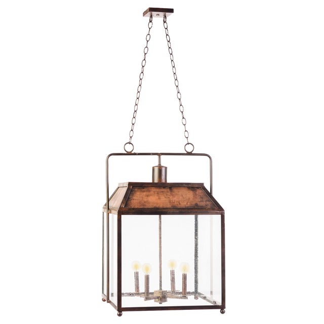 This Square Yoked Lantern is traditional in design and dressed up by adding seeded glass and a yoke. The four candelabra-...