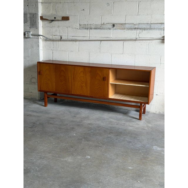 Beautiful vintage Scandinavian Modern sideboard crafted in warm teak by Troeds Bjärnum, Sweden. This elegant Mid-Century...