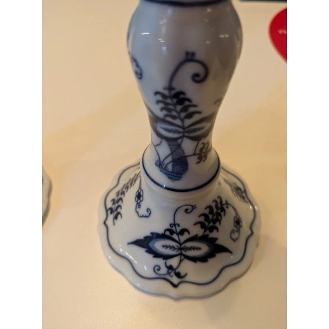 Add a touch of vintage elegance to your home with this charming set of Blue Danube Blue Onion Candlestick Holders, made in...