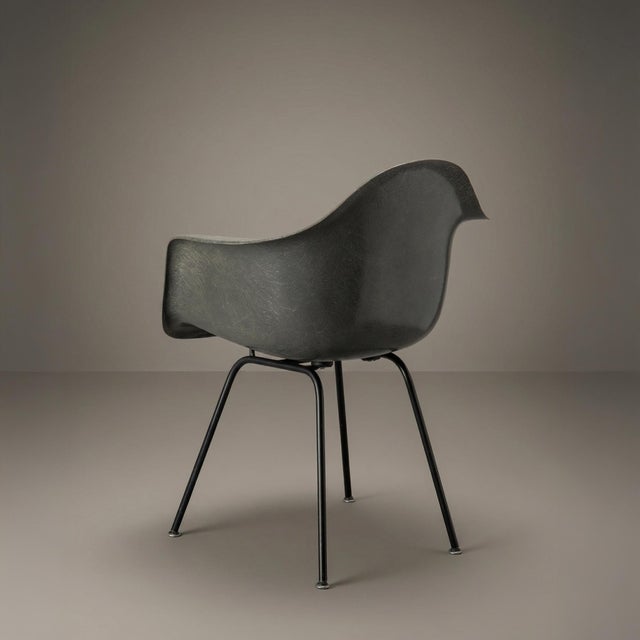 This is a very nice example of a second-generation Charles and Ray Eames DAX armchair for Herman Miller in Elephant Gray...