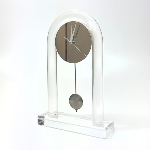 RELOCATION SUPER SALE! HUGE MARK DOWNS This stunning 1970s-arched Lucite and mirror mantel clock blends sleek modernism...