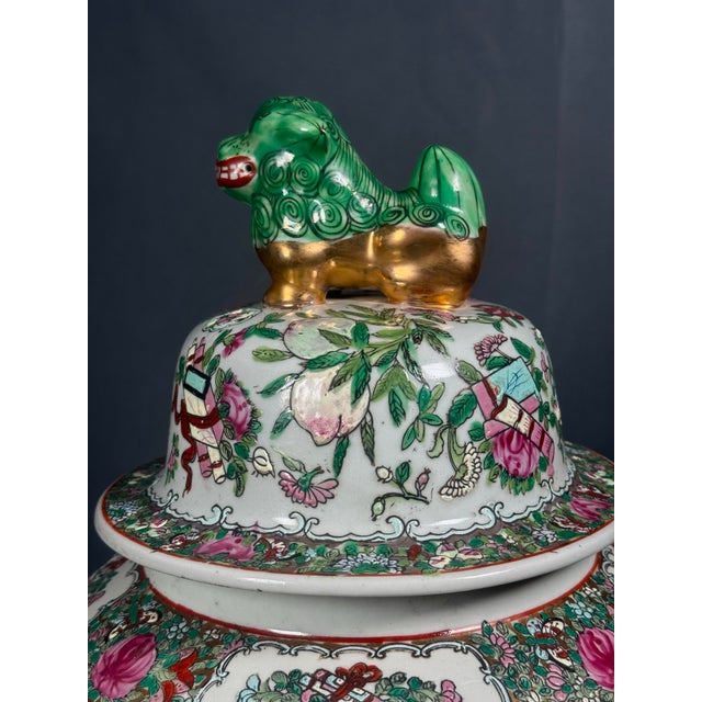 highly decorative Chinese Rose Medallion style enameled porcelain covered urn, richly decorated with colorful figural...