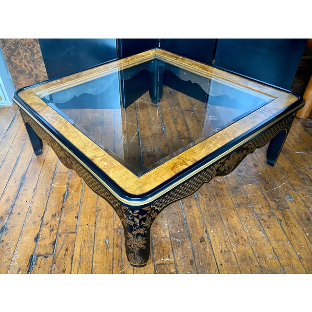 Large square Hollywood Regency style burl wood and glass coffee table by Drexel Furniture. This sculptural cocktail table...