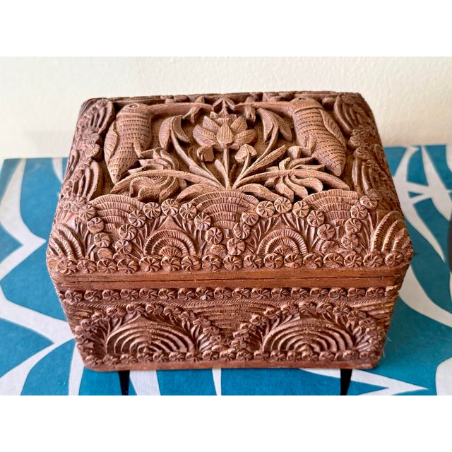 Fascinating one-of-a-kind 1940s cigarette box from beautifully hand-carved wood. Unfolds into a dispenser with slots for...