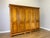 A substantial Vintage French wardrobe with a clean five-door design, raised panel fronts and a warm polished finish. The...