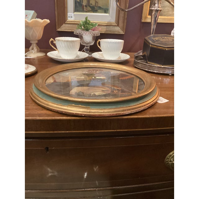 A beautifully atmospheric 19th century oil on board painting presented in a distinctive rondo format, depicting a tranquil...