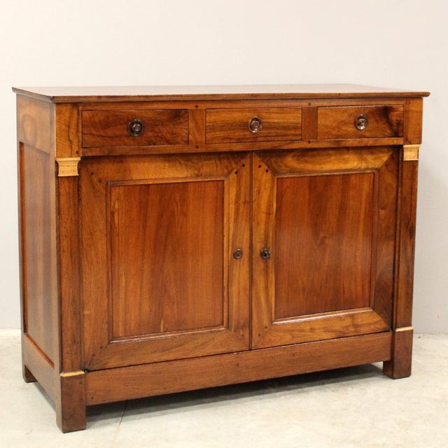 Empire sideboard In solid walnut Early 19th century era - Empire (Restoration period) Measurements: width 130 cm, depth 54...