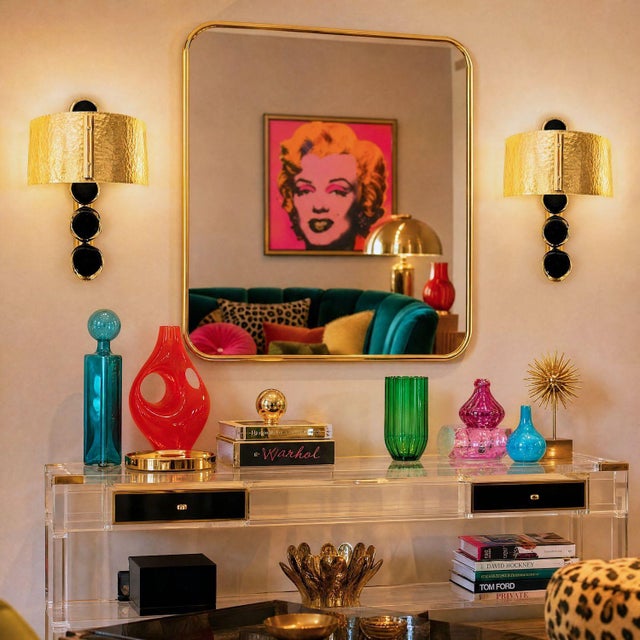 Pair of mid century modern Murano glass and brass sconces, Italy 1980s. The Italian sconces are made of a large gold...