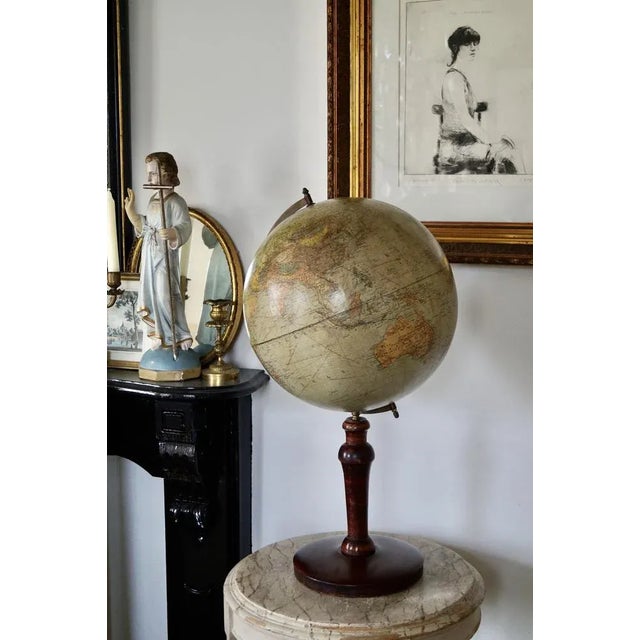 Globe by Dietrich Reimers berlin in the 1930's Made of papier mache with a wooden foot. This piece has an attribution...