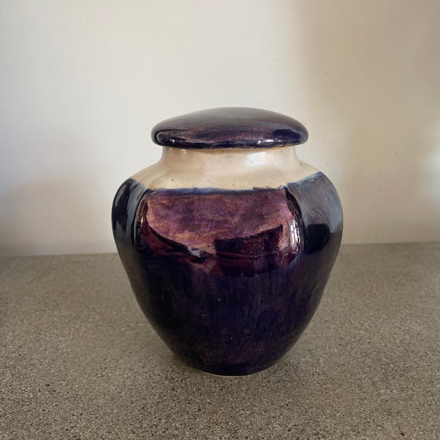 American Arts and Crafts urn with white and deep blue metallic glaze.