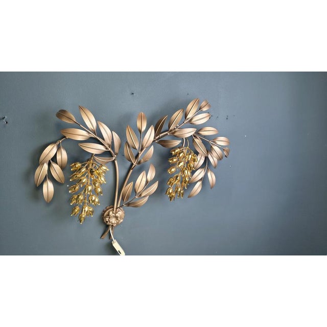 Vintage gold metal and brass wall lamp by Hans Kögl with leafs and tulips. The wall lamp has 2 dimmable light points....