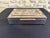Rare box with double compartments, beautifully made, covered in shiny chrome, brass frieze and wooden interior. This box...