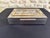 Rare box with double compartments, beautifully made, covered in shiny chrome, brass frieze and wooden interior. This box...