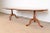 An exceptional Georgian or Queen Anne style solid cherry wood double pedestal extension dining table By Henkel Harris USA,...