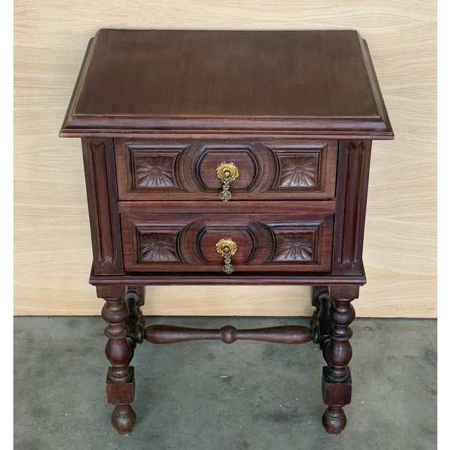 20th century pair of Spanish nightstands with two carved drawer and iron hardware. Beautiful tables that you can use like...